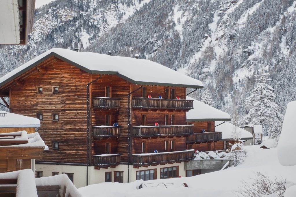 Typical mountain house in Santa Caterina Valfurva, Valtellina, Italy. Image gpiazzese Shutterstock