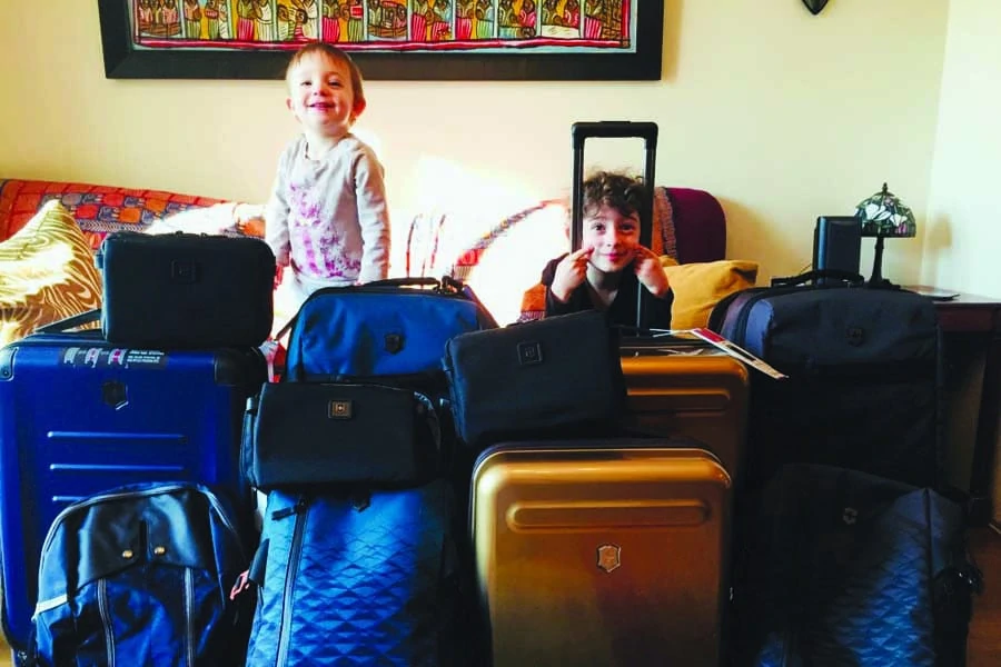 the kids with the luggage. image robin esrock