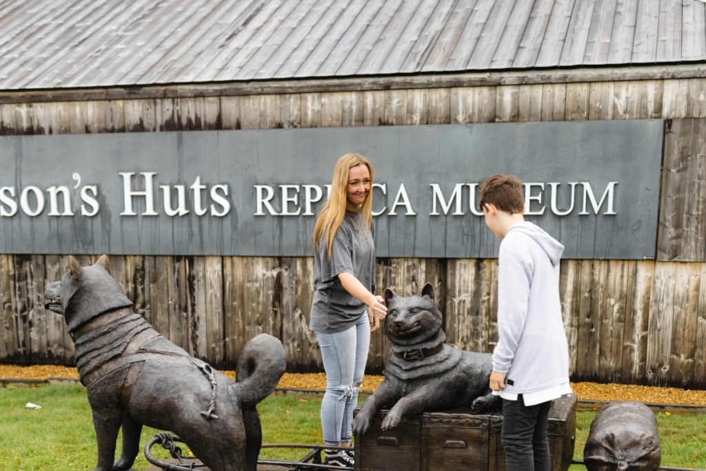 A family visits the Mawson's Huts Replica Museum in Hobart. Image Tourism Australia