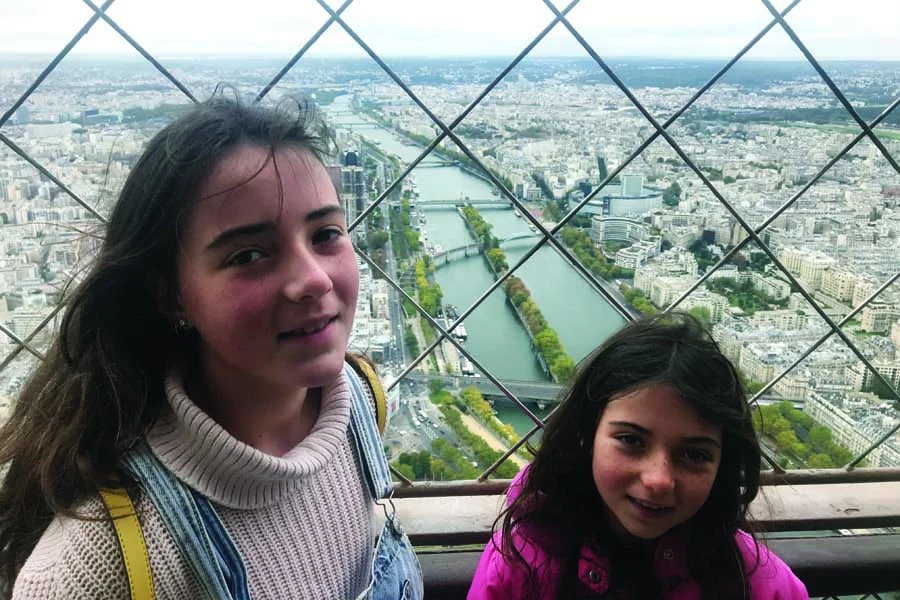 the girls at the top of the eiffel tower