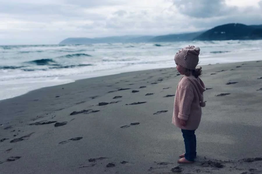 ruby at the beach. we love going to the beach even when its cold rebecca says