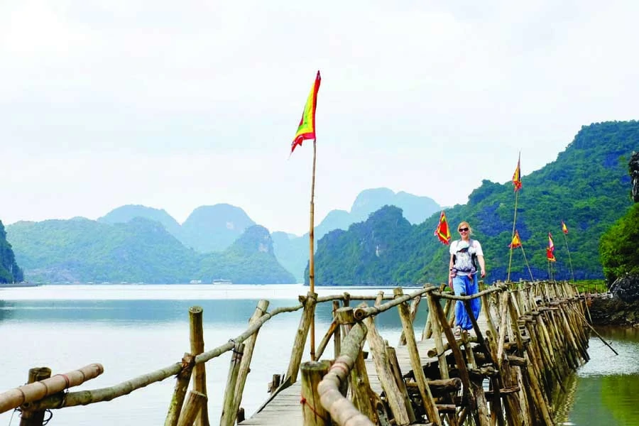 Walking across the Cat Ba Island bridge. Image: Kyle Rodriguez