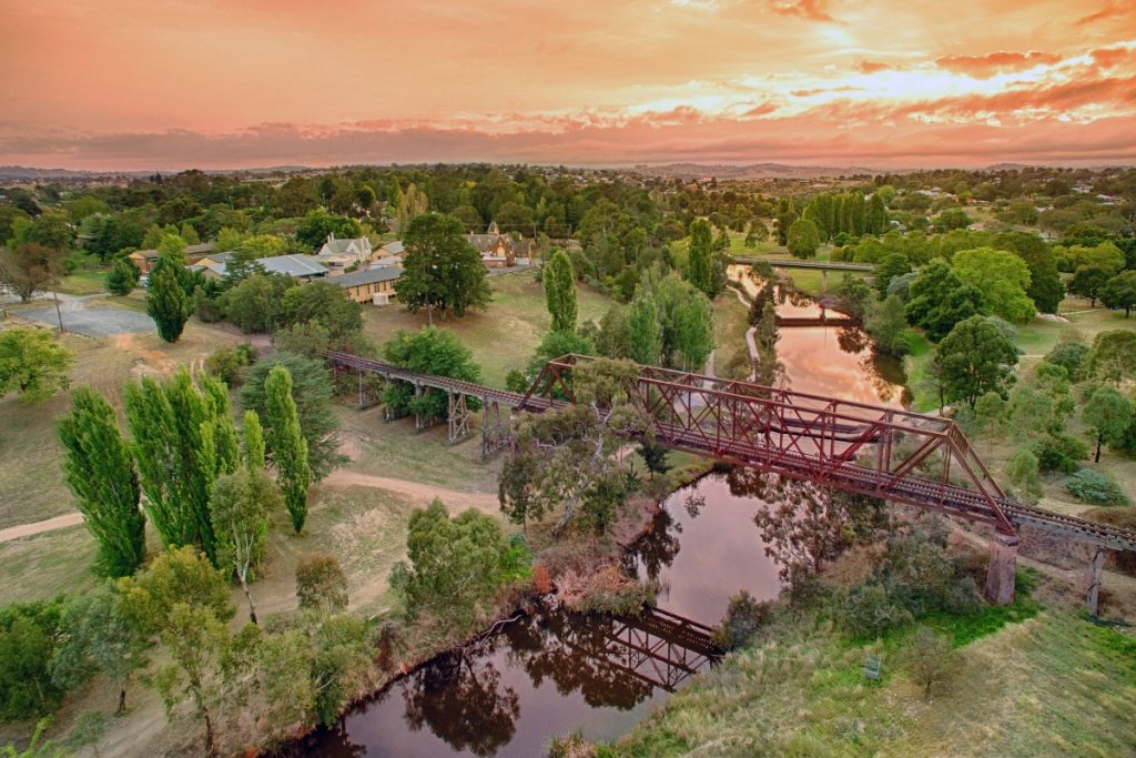 Sunsets over the Yass River and the old railway bridge. Image Destination NSW