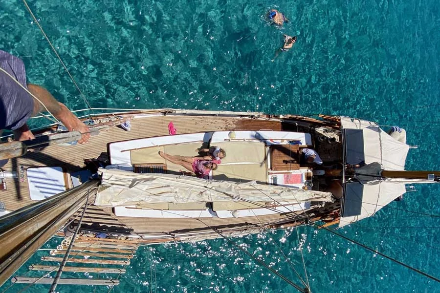 climbing the mast of a clipper while sailing paros