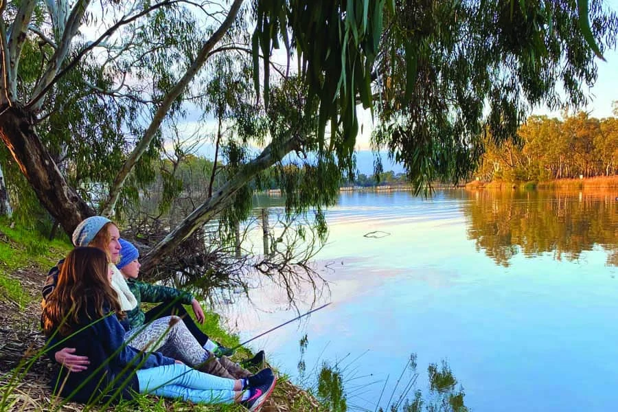 Katrina and the kids relaxing by the Murray River