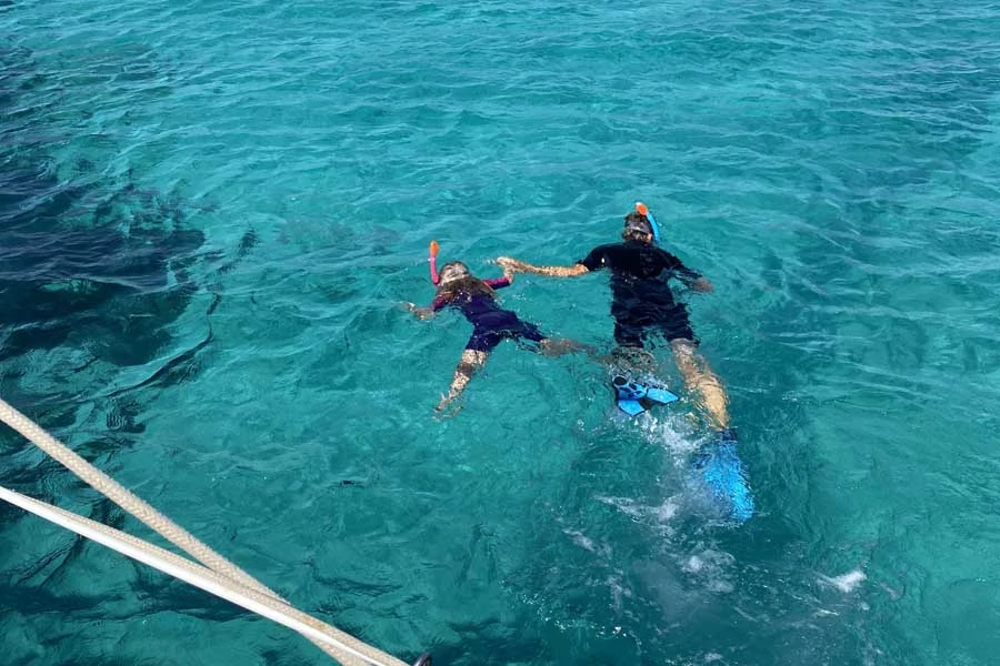 lotte snorkelling with dad from the clipper in paros. image flip byrnes