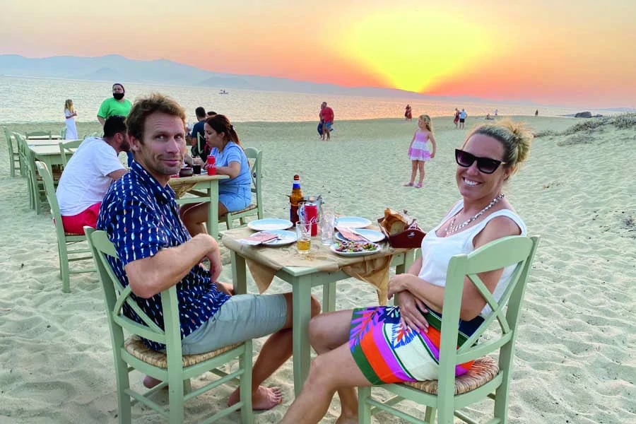 mum and dad enjoying the sunset at paradiso on naxos