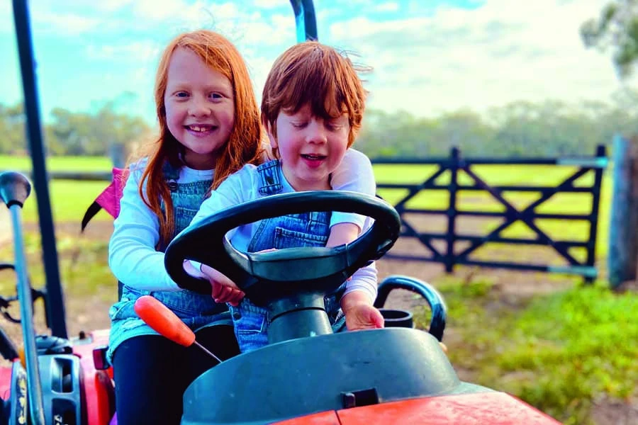 our two little farmers loving life on the land