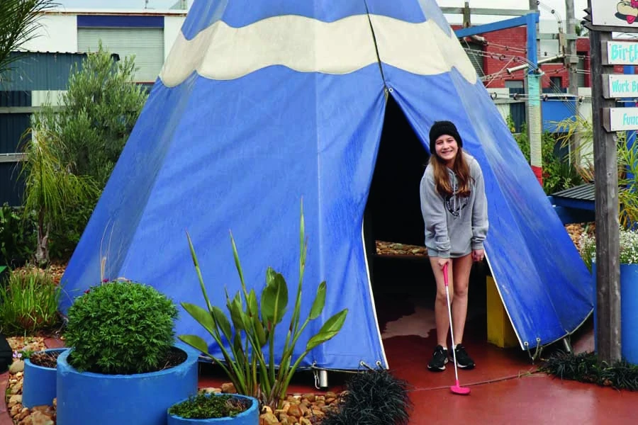 rose tackling the mini golf