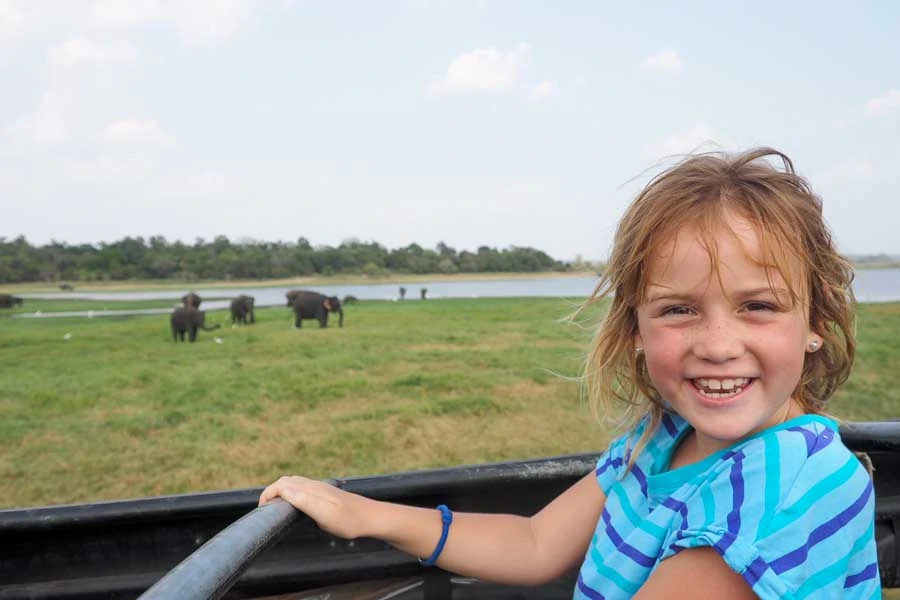 the face of a child seeing her first wild elephants