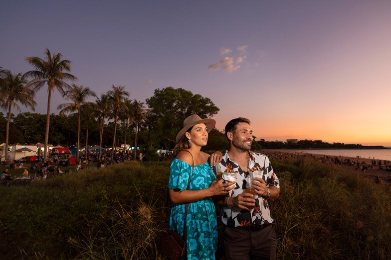 Couple enjoying the sunset at Mindil Beach Sunset Market image Tourism NT Shaana McNaught