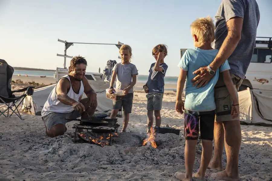 a family around a campfire during a tour with wula gura nyinda eco adventures in the shark bay world heritage area. image tourism western australia