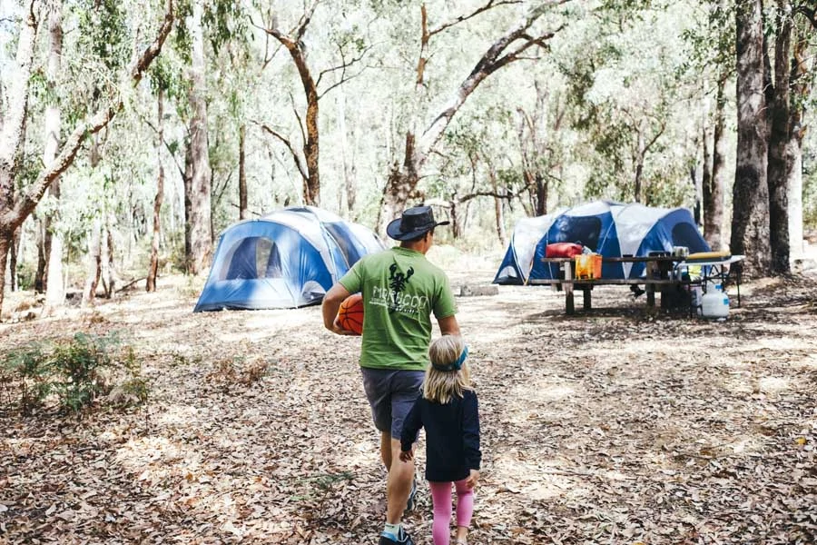 a family camping at lane poole reserve in dwellingup. image tourism western australia