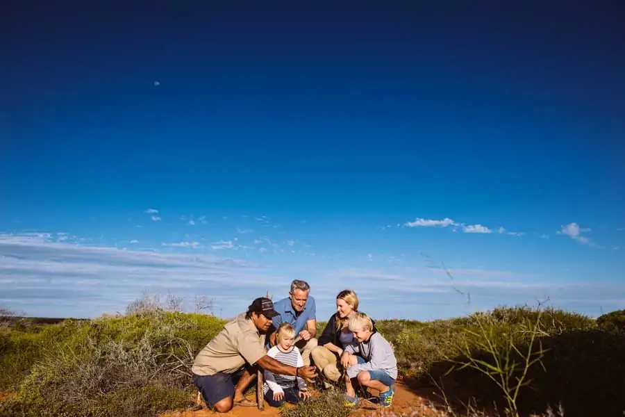 a family on an indigenous tour at monkey mia. image tourism western australia