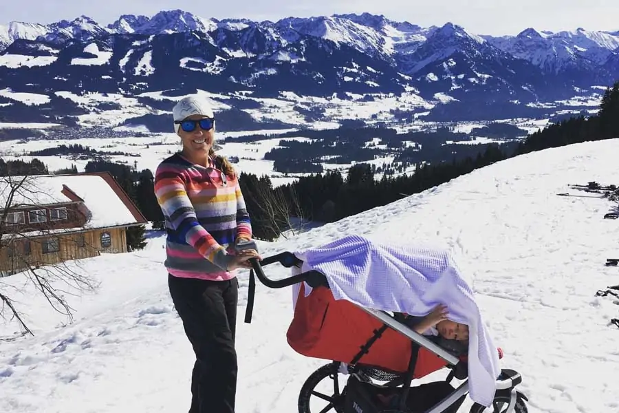 flip byrnes pushing the snow pram at allgauer berghof in germany