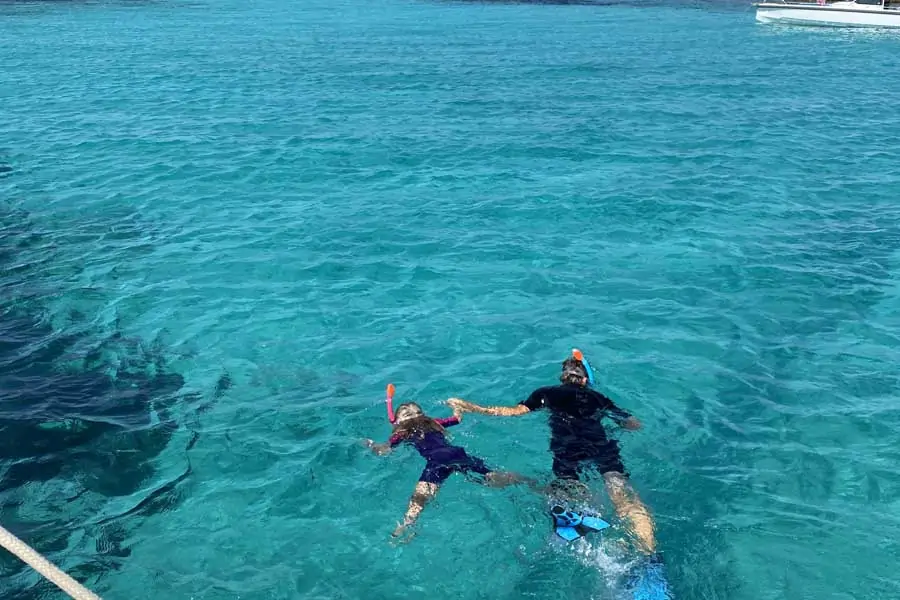 flips daughter lotte snorkelling with her dad in the greek islands. image flip byrnes