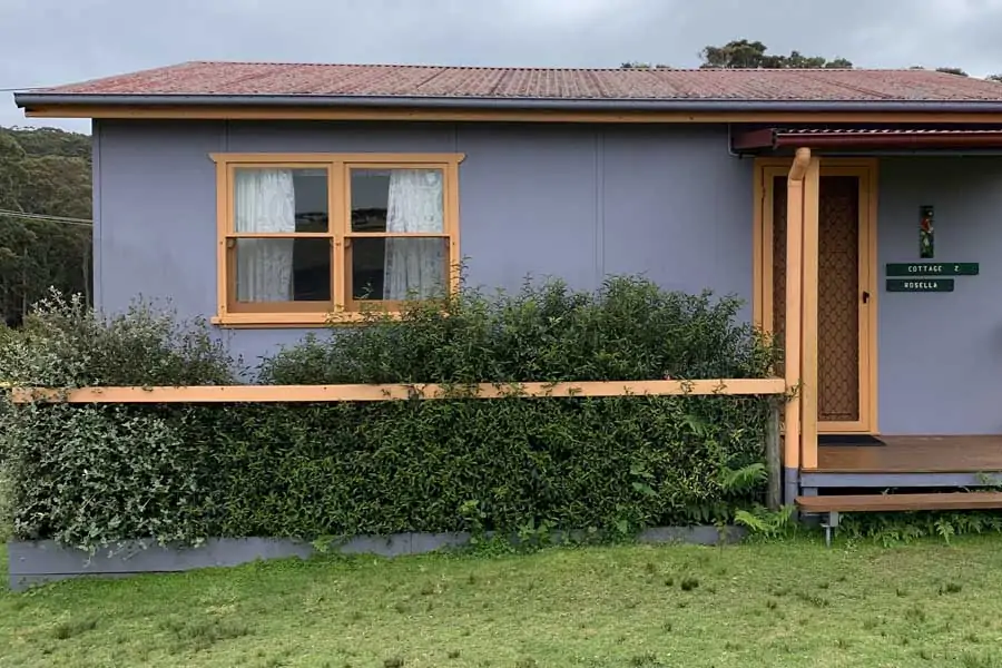 one of the colourful cottages at durras lake north holiday park