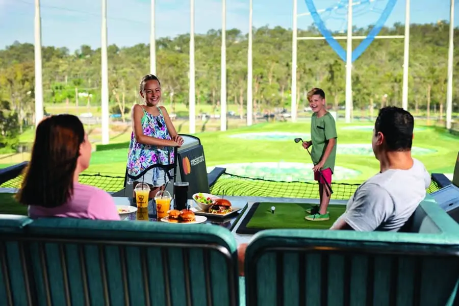family fun at top golf. image village roadshow theme parks