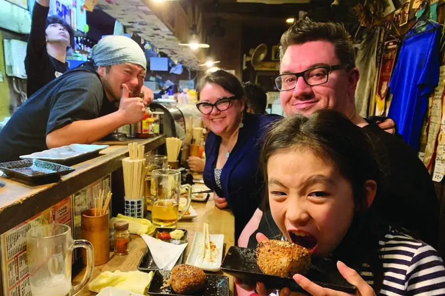 sally with her husband and lyann at hinotetsu yakitori restaurant in nagoya