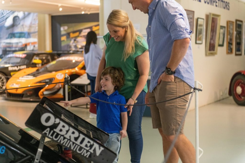Family enjoying The National Motor Racing Museum located at Murray's Corner, Mount Panorama in Bathurst. Image Destination NSW