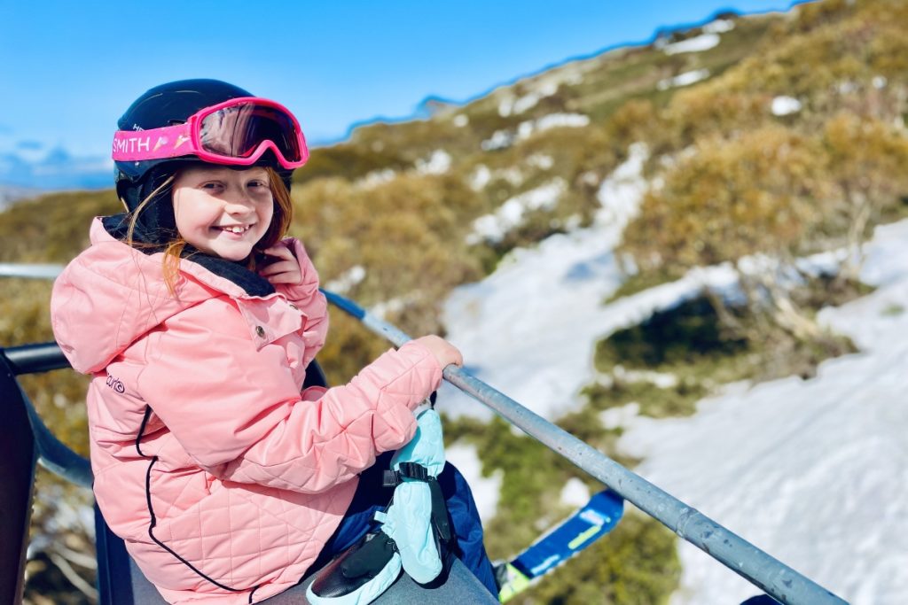 Daisy on top of the world on the Falls Creek ski lift. Image Meg Law