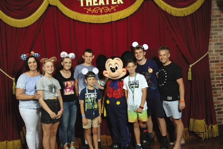 Rebecca Mason and her family with Talking Mickey at Magic Kingdom Disneyworld in 2018