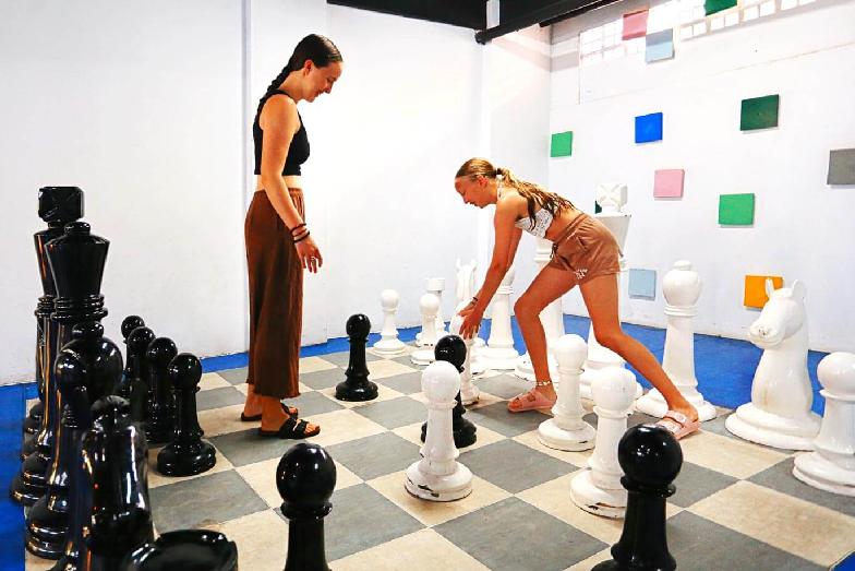 Girls playing giant chess in the kids club