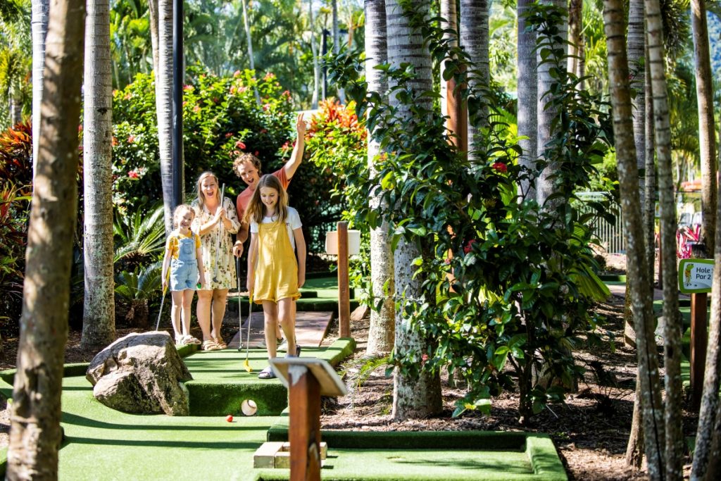 Family playing mini golf at BIG4 Adventure Whitsunday Resort in Airlie Beach