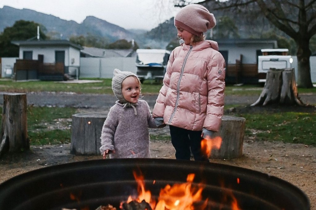 Kids in front of the communal fire pit at NRMA Halls Gap Holiday Park