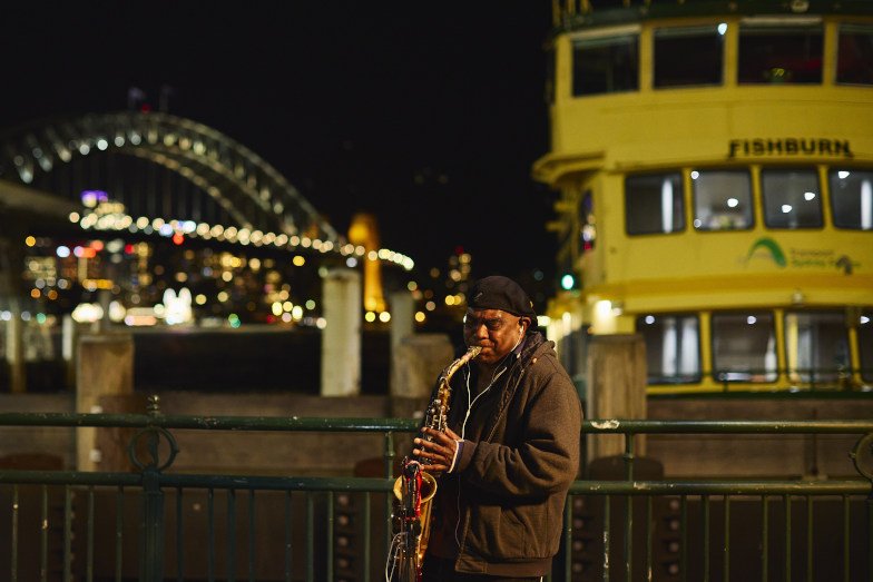 A busker performing at Circular Quay in Sydney. Image: Destination NSW