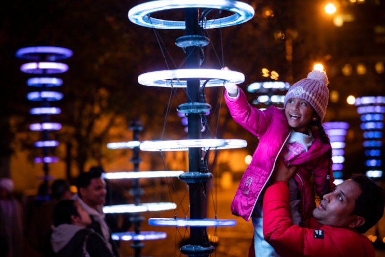 A family enjoying Vivid Sydney. Image: Destination NSW