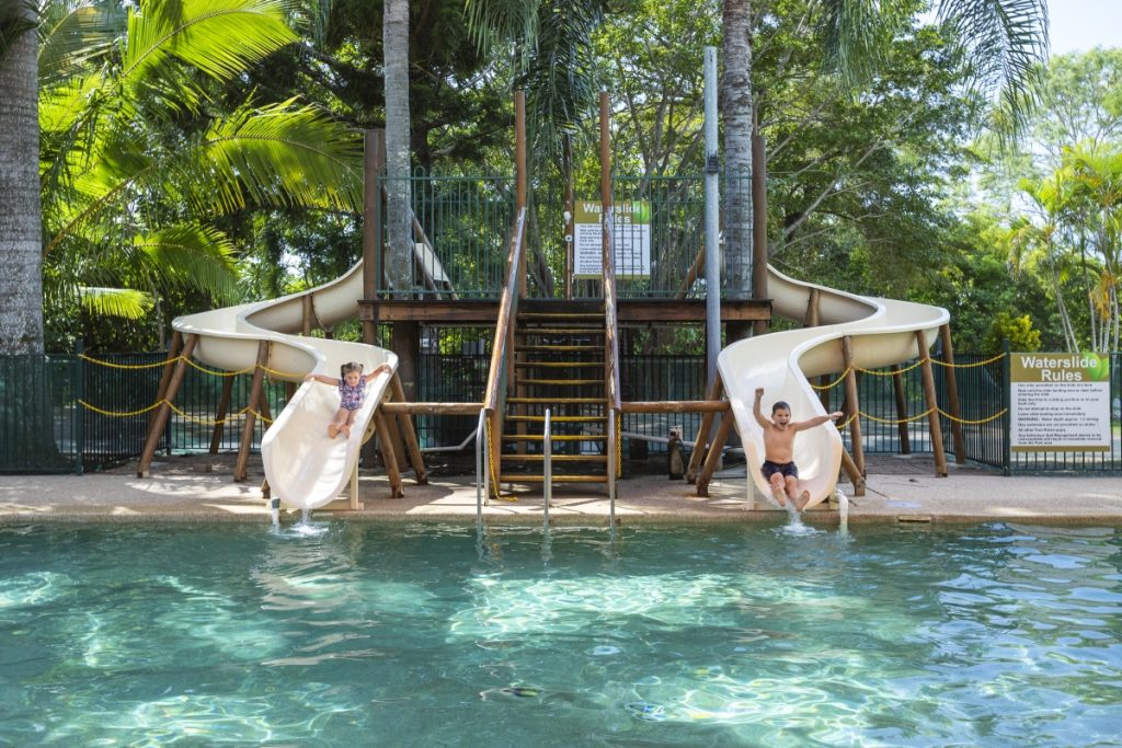 Kids play on the water slides at Cape Hillsborough Tourist Park in Mackay. Image Tourism and Events Queensland
