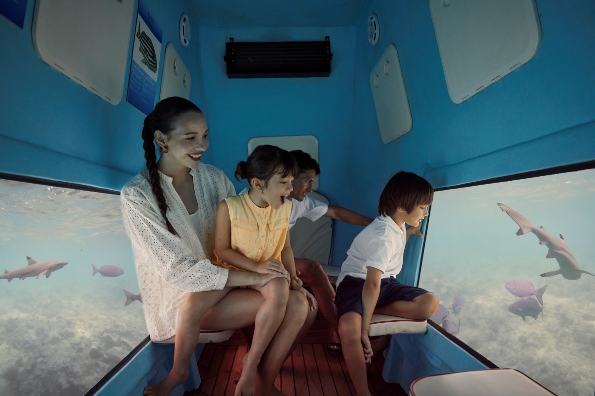 Family enjoying a semi submarine tour at Machchafushi Island Resort and Spa Maldives