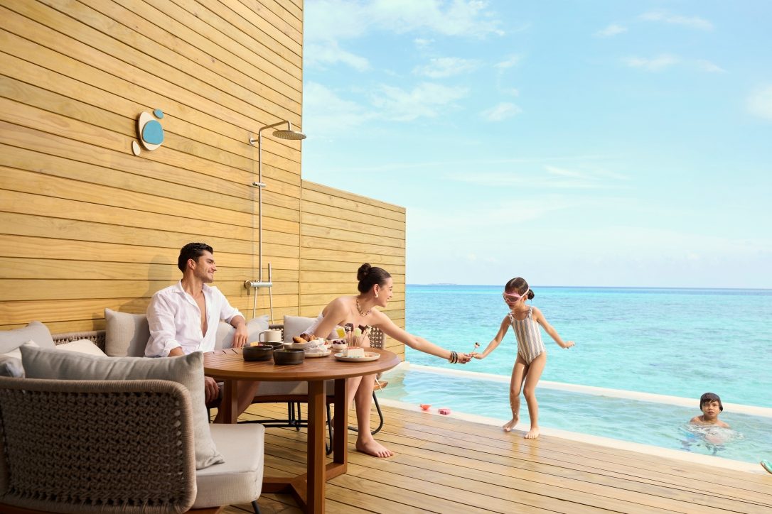 Family enjoying their Mirage Overwater Sunset Pool Villa at Centara Mirage Lagoon Resort Maldives