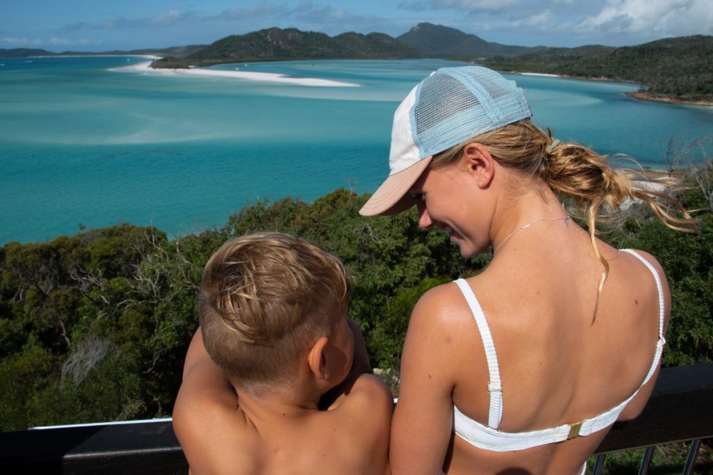Family takes in the view from Hill Inlet Lookout at Whitehaven Beach. Image Tourism and Events Queensland