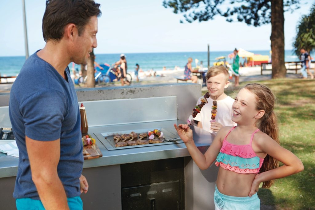 Family enjoying a barbecue at one of the Gold Coast's beachfront parks