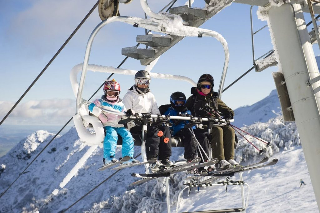 A family on a chairlift at Mt Buller. Image Andrew Railton Mt Buller